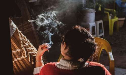 cannabis friendly lodging - female with a smoking joint