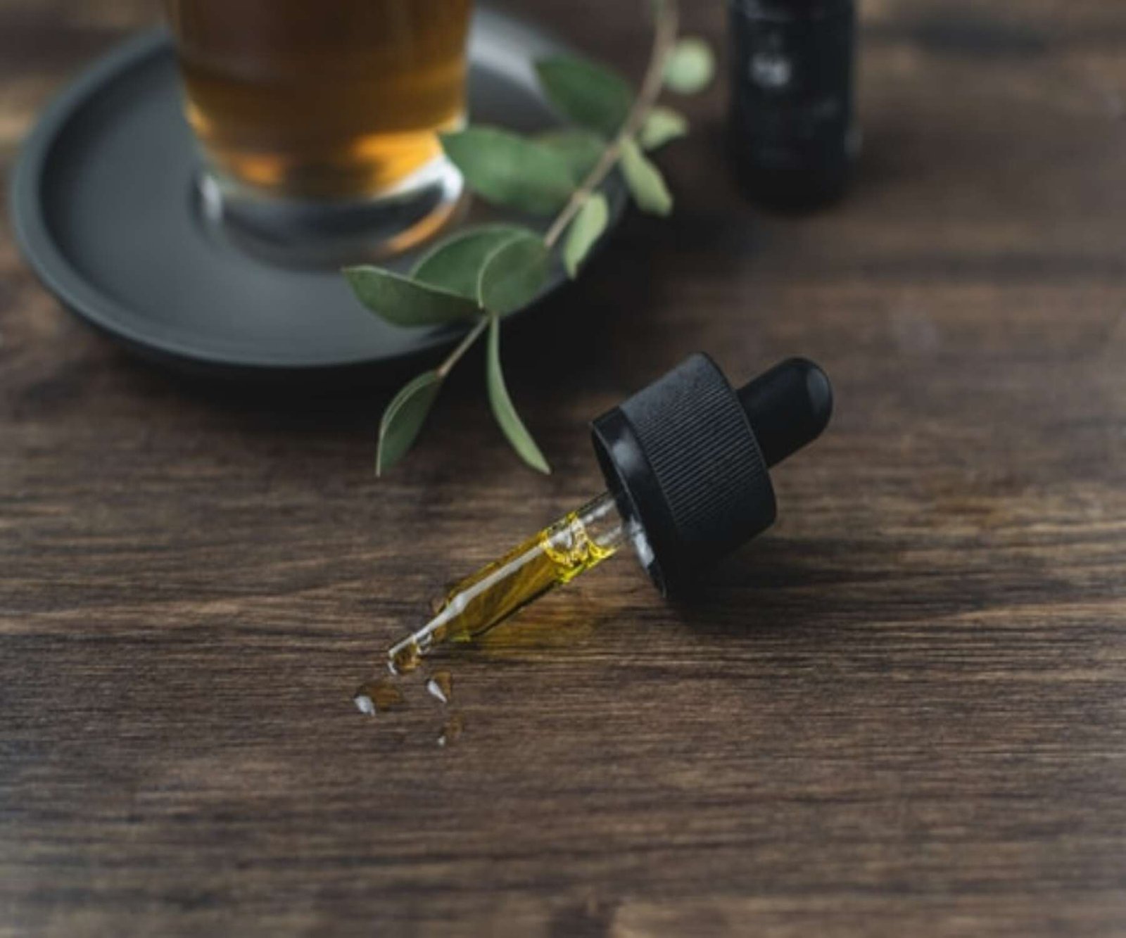 cbd oil in dropper on table