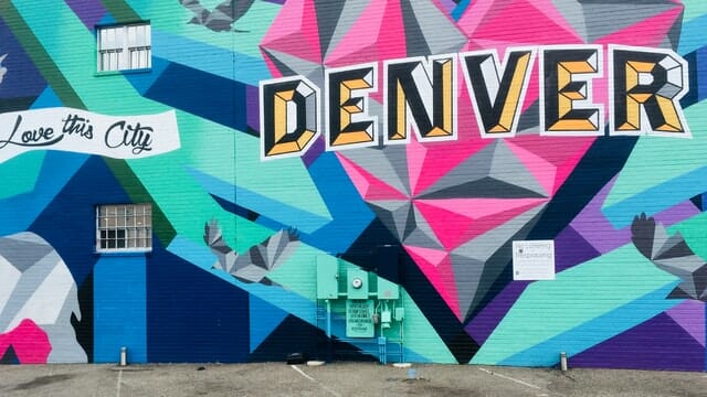 painting on wall saying love this city denver