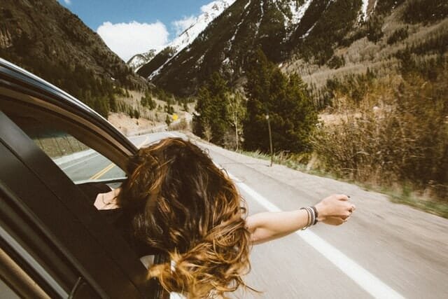 woman traveling in car