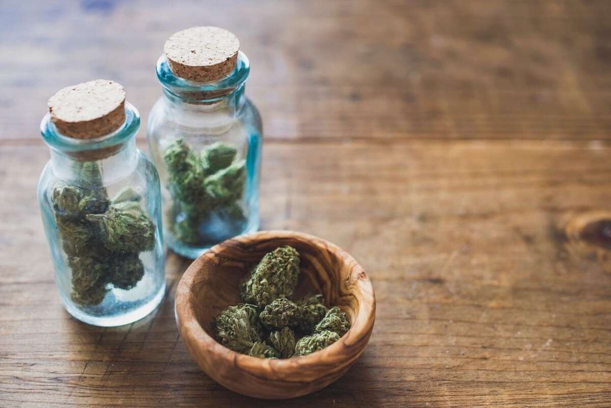 table with two bottles of cannabis