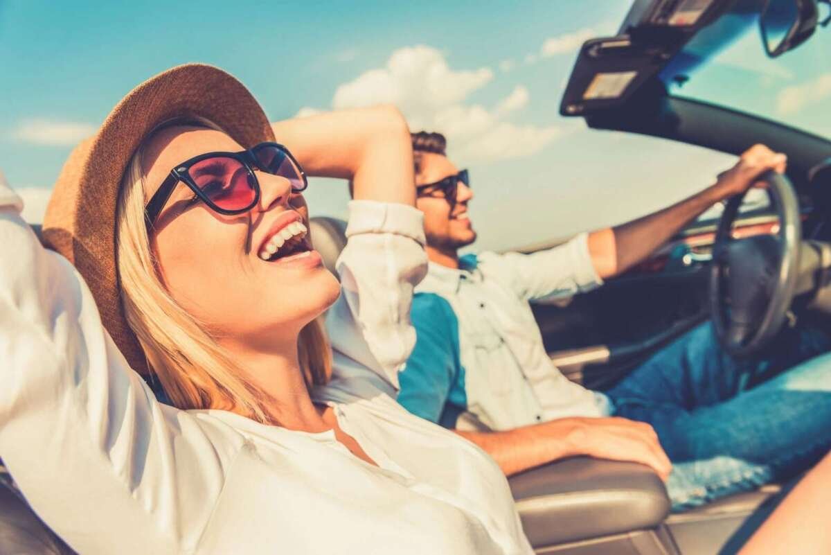 couple in car smiling having fun