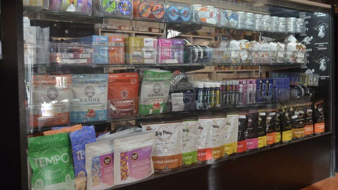 cannabis products on a shelf in a dispensary 