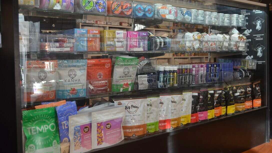 cannabis products on a shelf in a dispensary 