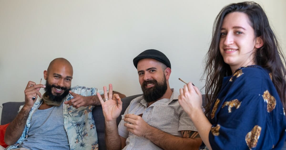 people smoking cannabis having fun, smiling.