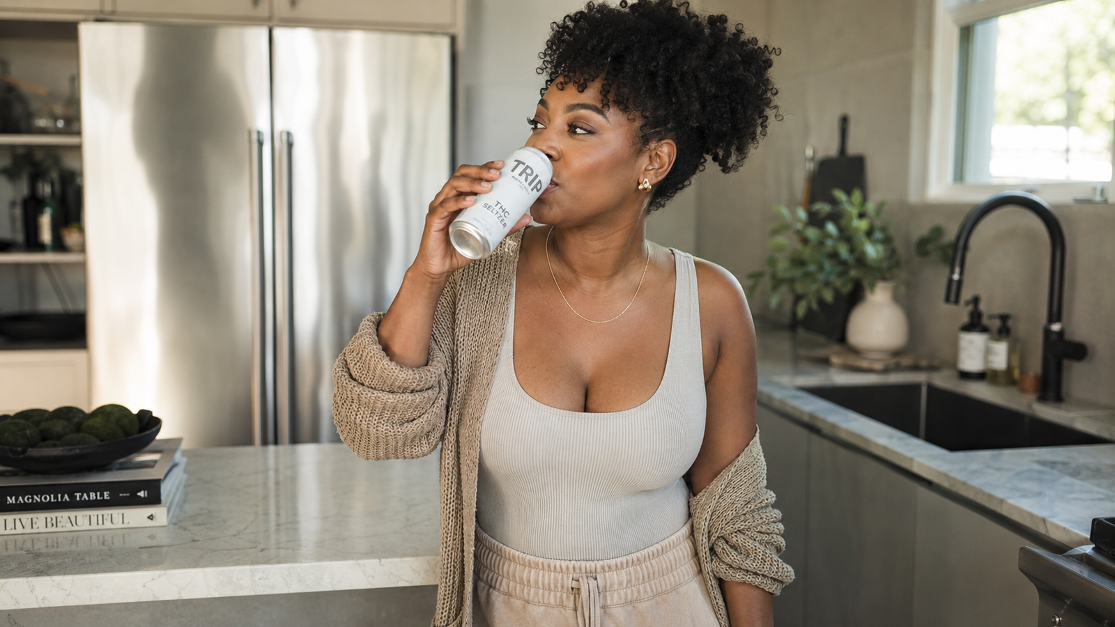 lady drinking a thc seltzer